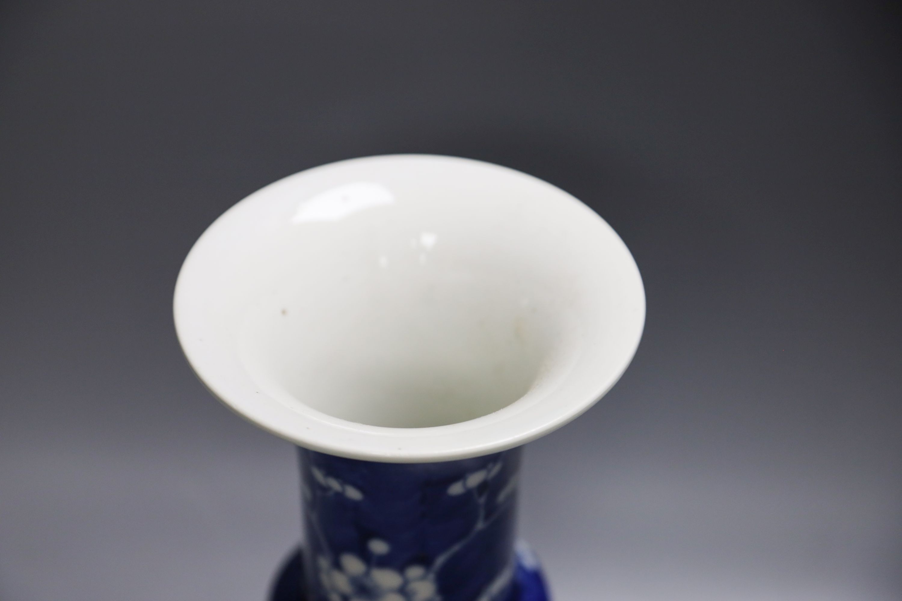 A Chinese blue and white prunus decorated gu vase, 26.5cm